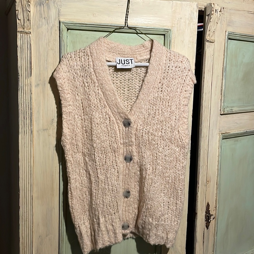 Barely worn cream sweater vest.
